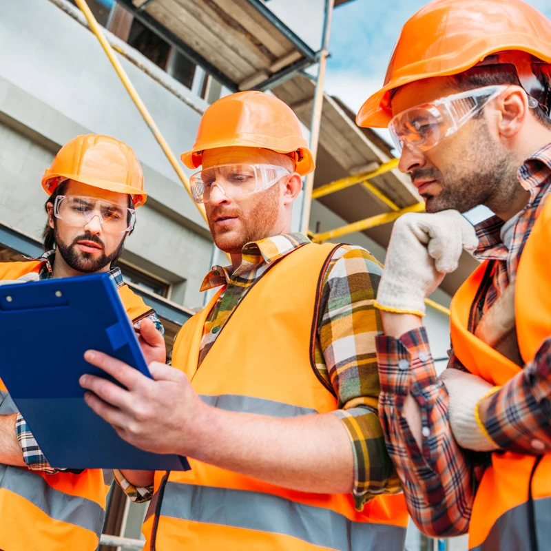 bottom-view-of-group-of-builders-in-hard-hats-and